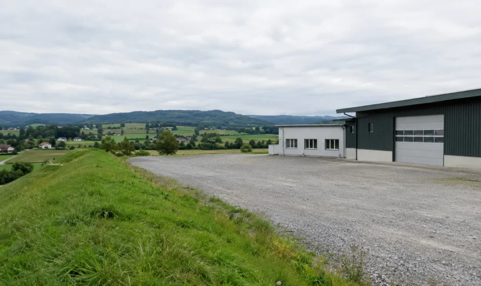 Rural company site embankment in Thurgau, Switzerland, similar to the site of the September 2026 Buhwil accident