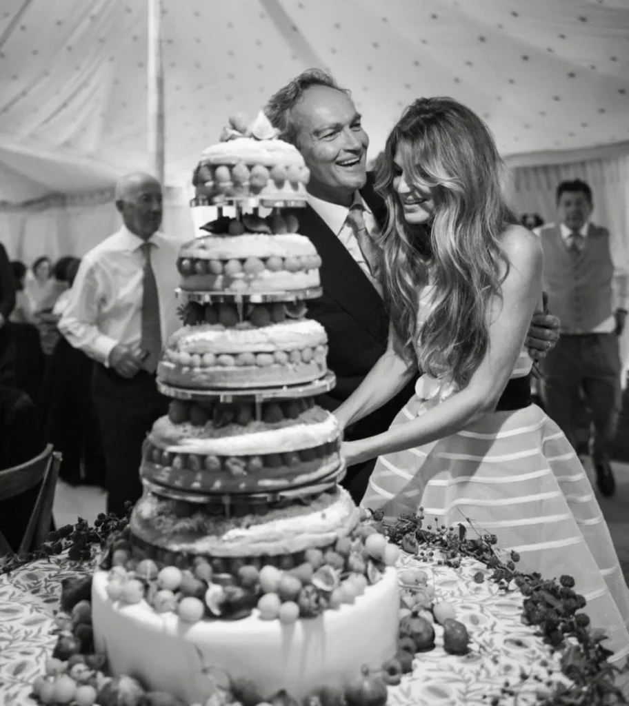 jemima and cameron cut the cake during their wedding ceremony